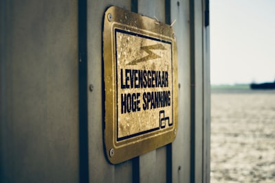 gold-colored metal signage on wall